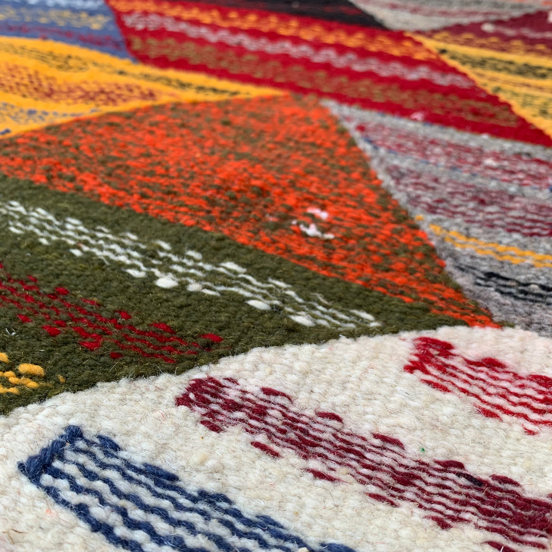 Close-up of a multicolored woven small kilim rug