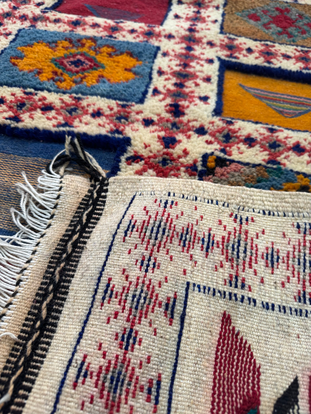 Detail of natural wool and traditional Berber weaving techniques on a Moroccan runner rug