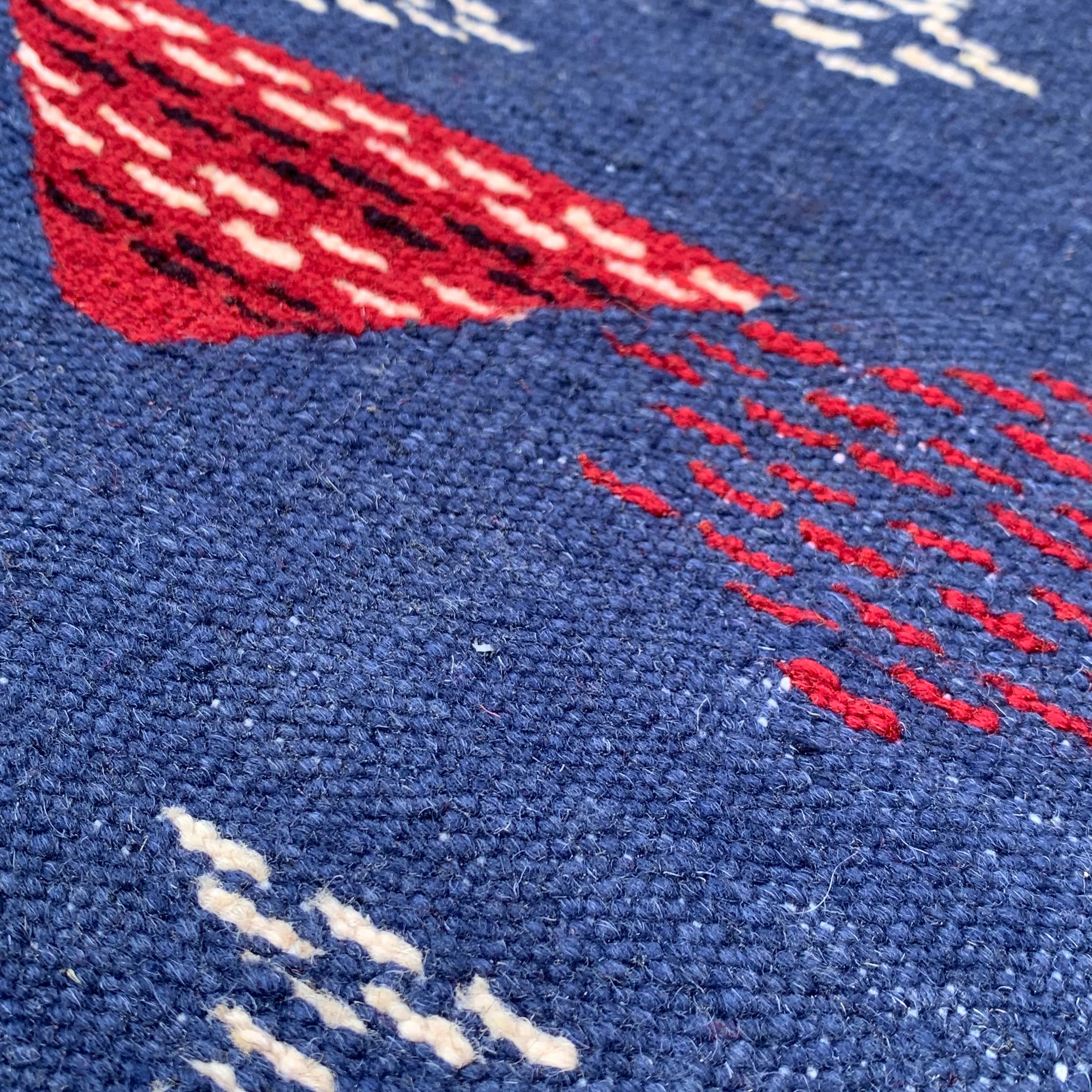 Close-up of a Navy Blue Kilim Rug