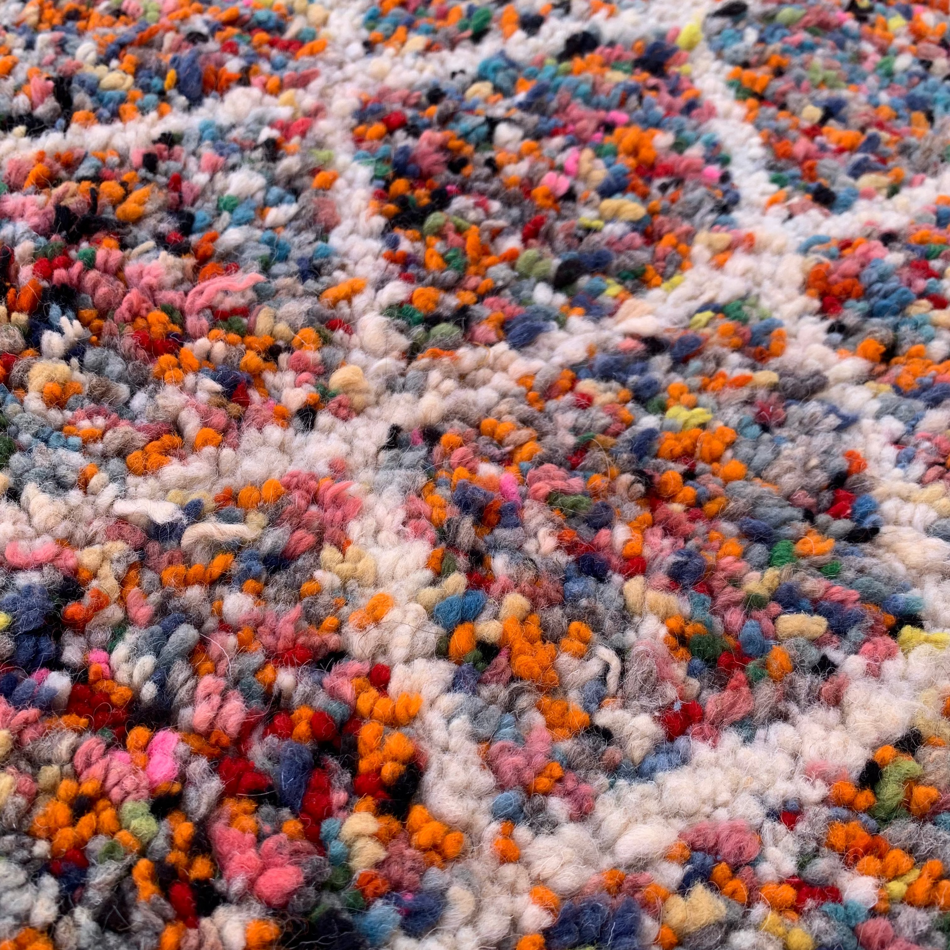 Multicolored knotted rug with a geometric pattern
