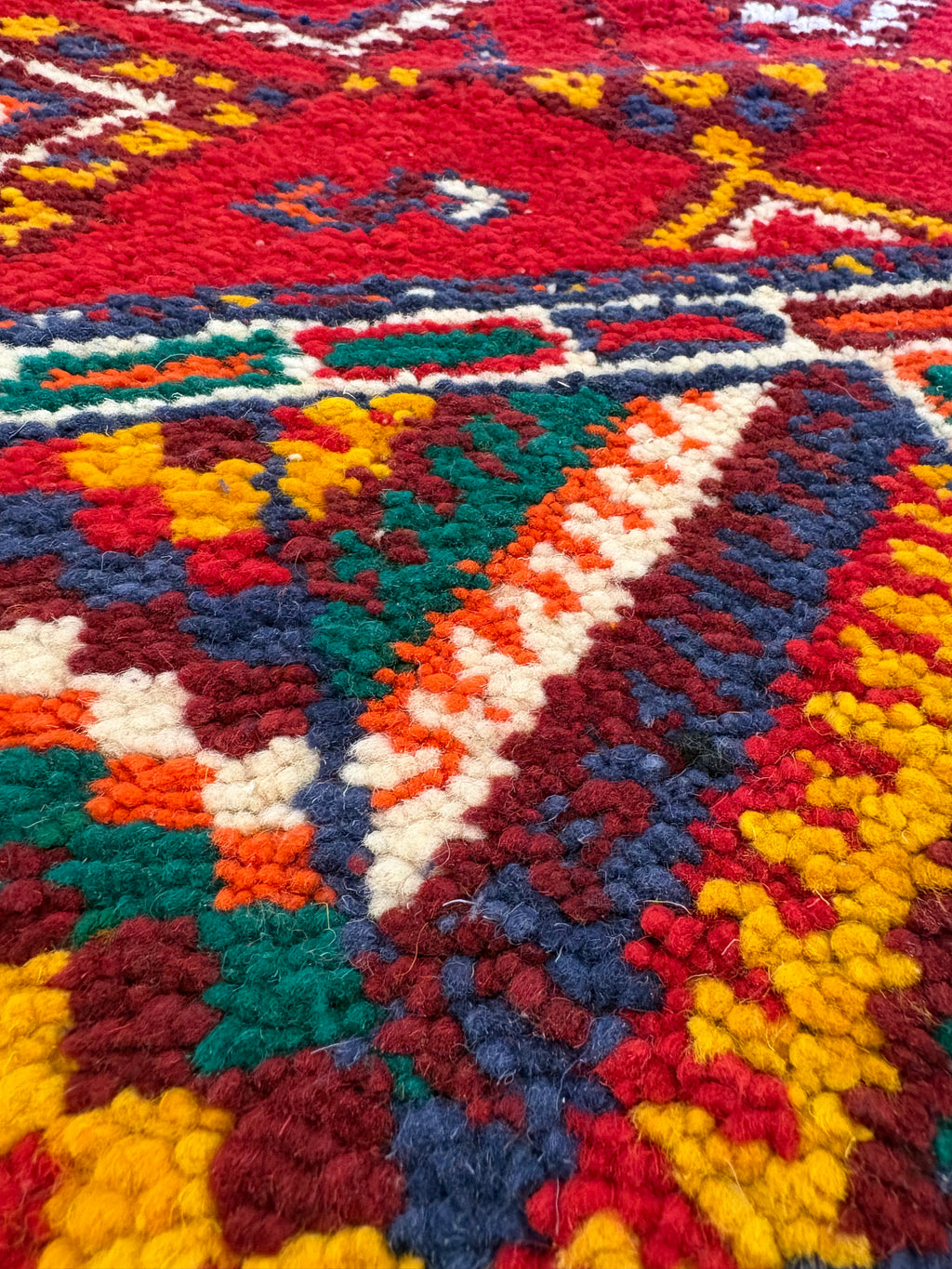 Close-up of traditional Amazigh weaving techniques in a Moroccan Berber wool rug
