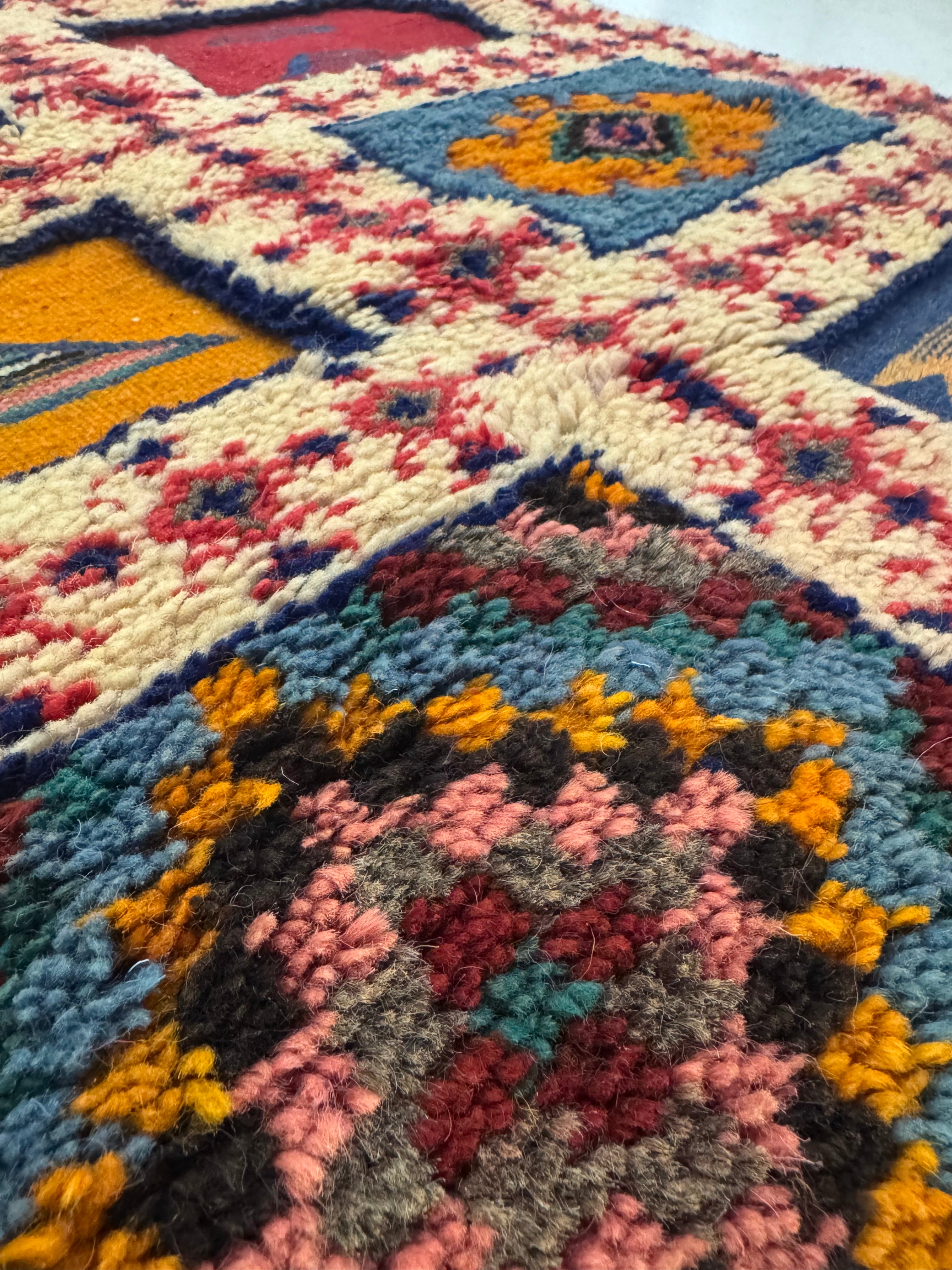Close-up of hand-knotted and flatwoven wool texture on a Moroccan Berber runner rug