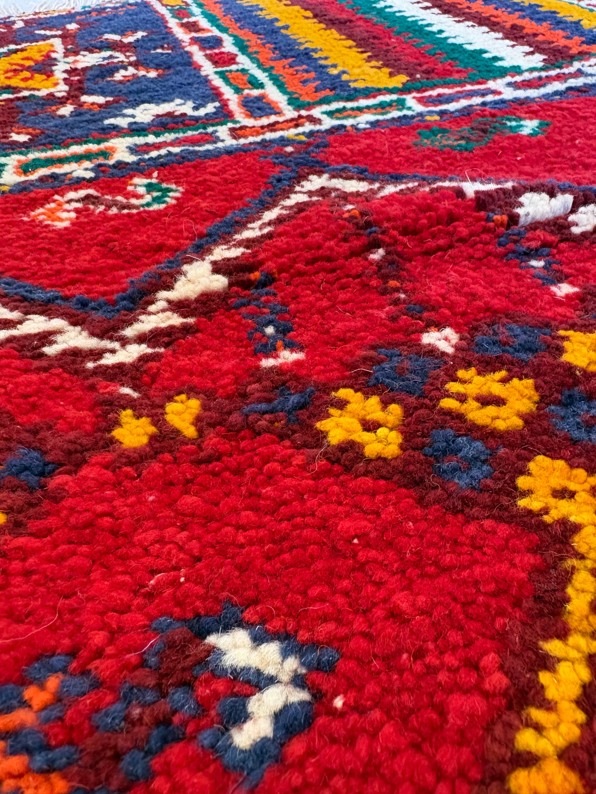 Detailed texture of a handwoven Moroccan Berber rug crafted from natural Atlas Mountain wool