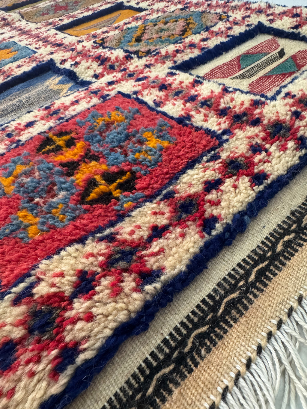 Close-up of hand-knotted and flatwoven wool texture on a Moroccan Berber runner rug