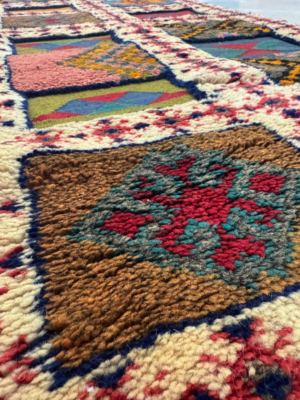 Close-up of hand-knotted and flatwoven wool texture on a Moroccan Berber runner rug