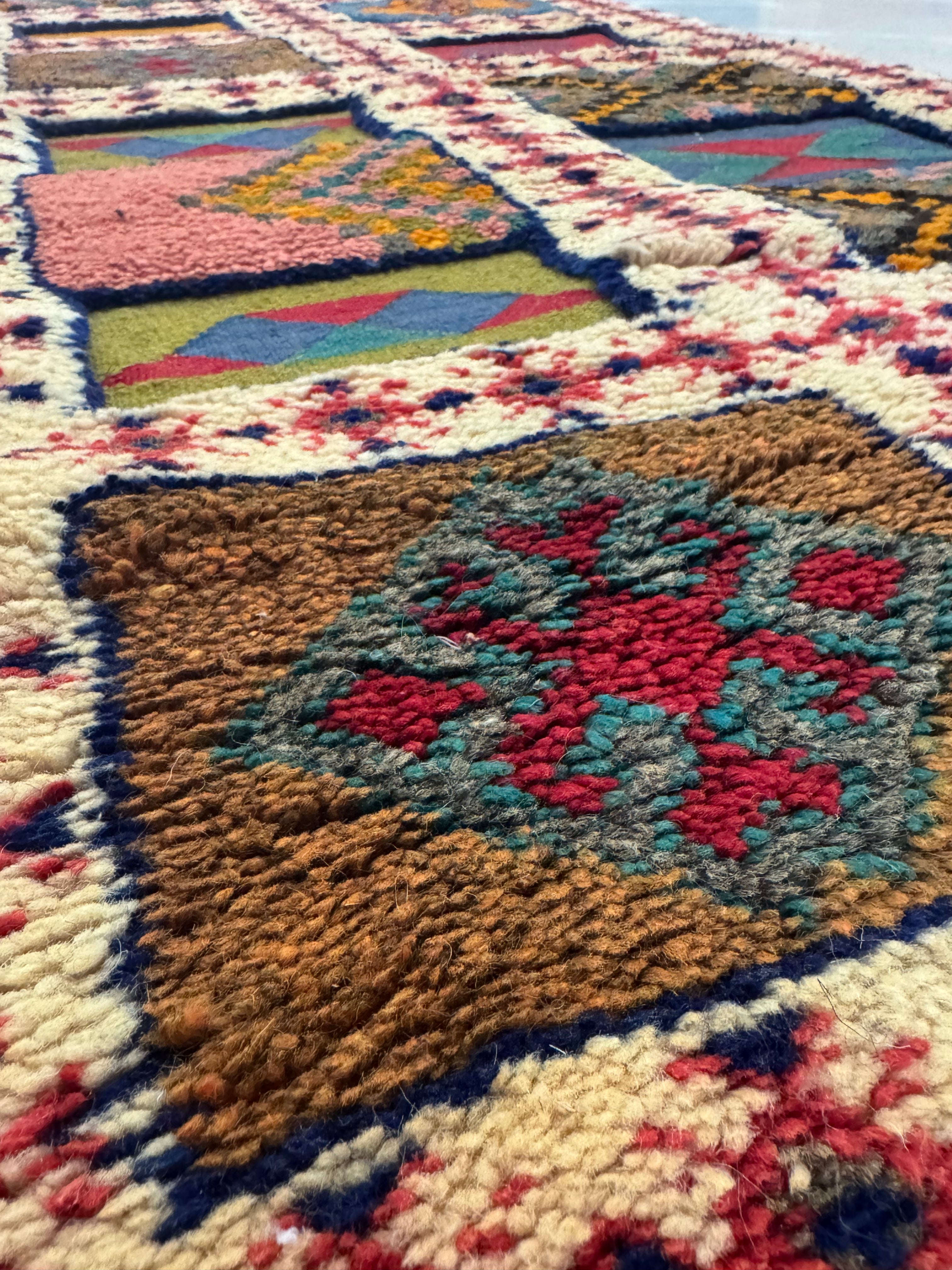 Close-up of hand-knotted and flatwoven wool texture on a Moroccan Berber runner rug