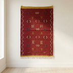 Handwoven Moroccan kilim rug in deep red with mint green border and Amazigh symbols – 100 × 67 cm
