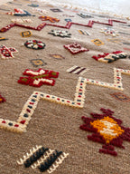 Traditional Amazigh symbols woven into a Moroccan Berber kilim rug
