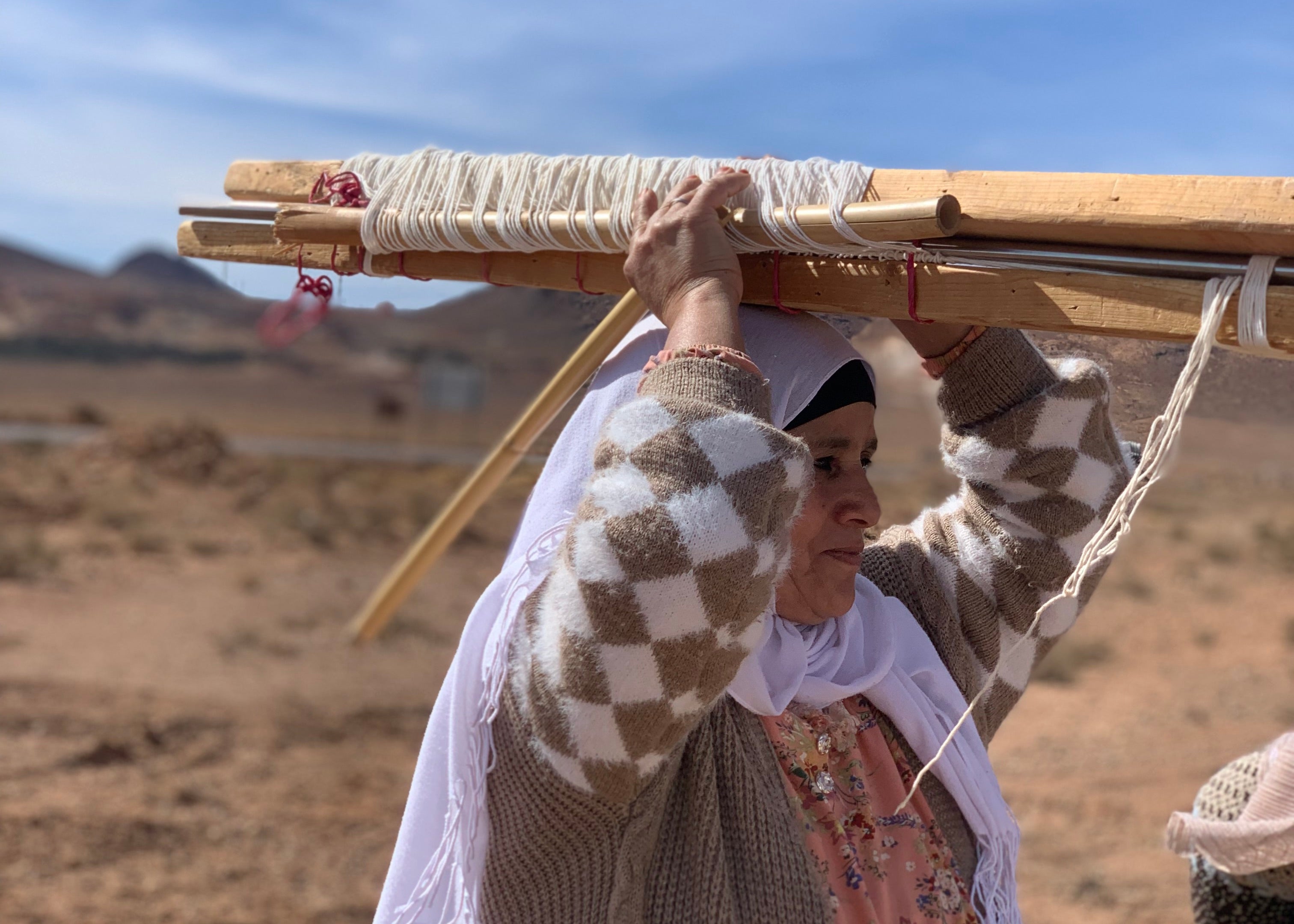 Moroccan rug being prepared by TazRugs artisan by hand  – TazRugs