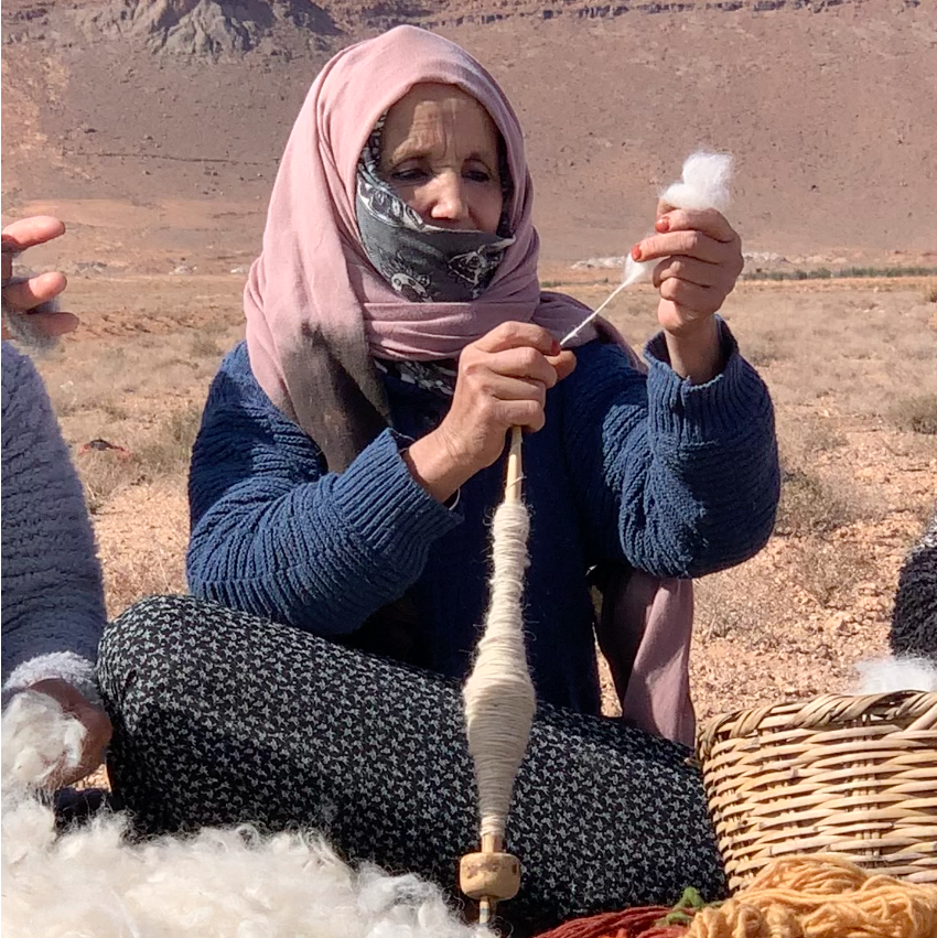 tazrugs artisan spinning wool by hand for traditional Moroccan rugs – TazRugs