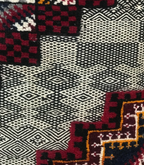 Close-up of Atlas Emblems Taznakht rug showing Zanafi flatweave and raised hand-knotted wool texture