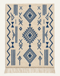 Indigo Glyphs custom Azilal rug in natural ivory and deep indigo blue, hand-knotted in Morocco