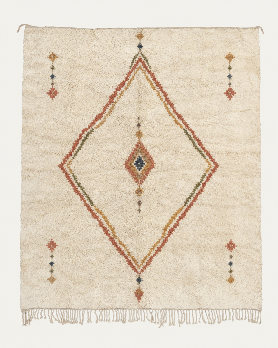 Inner Compass Beni Ouarain custom Moroccan rug with a large terracotta, ochre and olive diamond surrounding a smaller central geometric motif on warm ivory wool