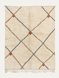 Kindred Lines Beni Ouarain custom Moroccan rug with indigo and cocoa diagonal lines joined by terracotta accents on warm ivory wool