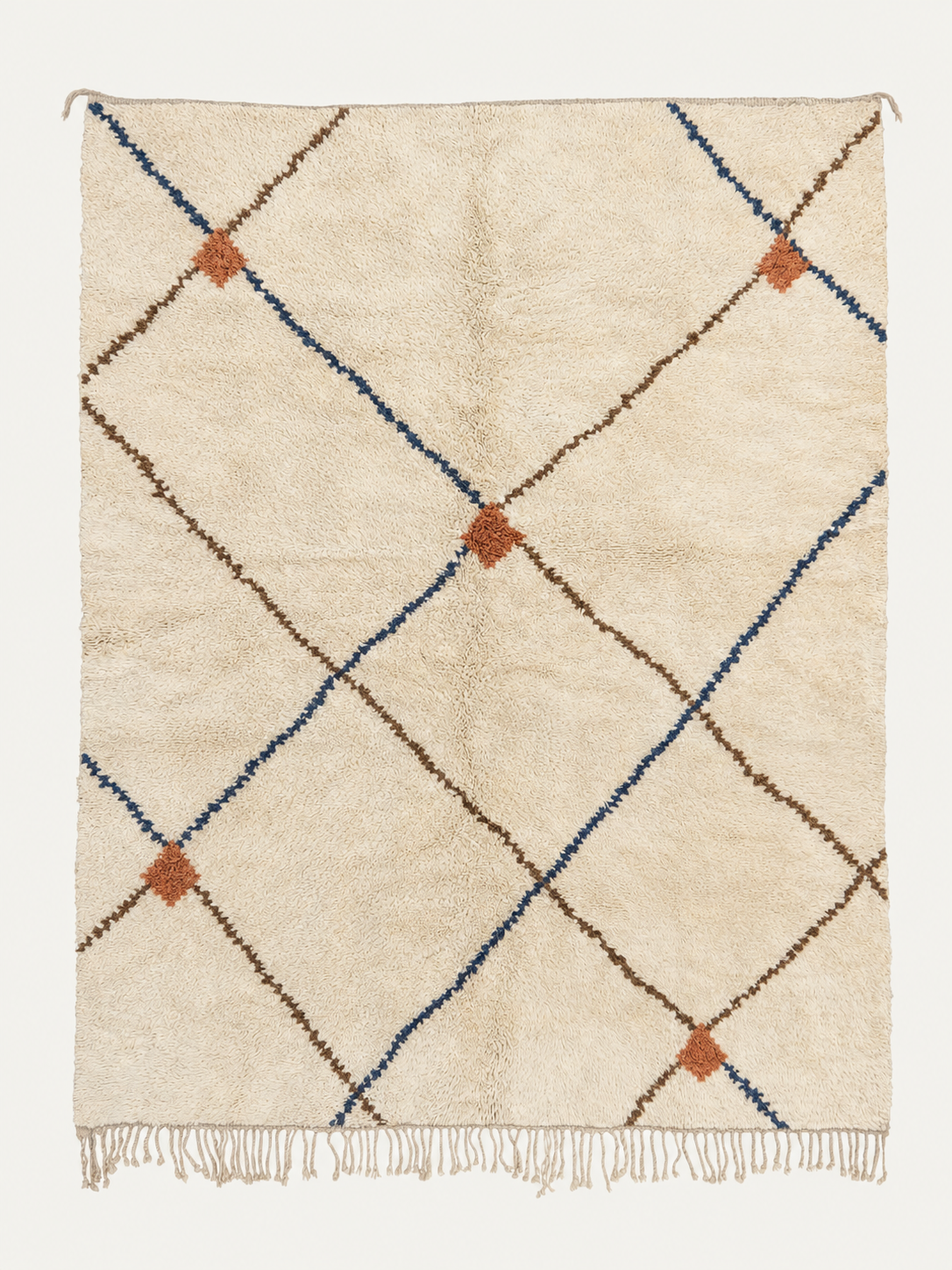 Kindred Lines Beni Ouarain custom Moroccan rug with indigo and cocoa diagonal lines joined by terracotta accents on warm ivory wool