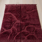 Floor shot — Burgundy Beni Mrirt Moroccan rug on a light oak floor with hand-finished fringe at both ends