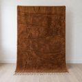 Caramel Beni Mrirt wool rug at the wall, medium pile with flatweave lines