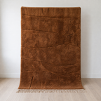 Caramel Beni Mrirt wool rug at the wall, medium pile with flatweave lines