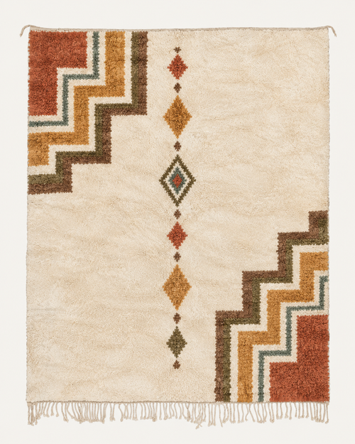 Throughline Beni Ouarain custom Moroccan rug with terracotta, ochre, olive and blue-green geometric motifs on warm ivory wool