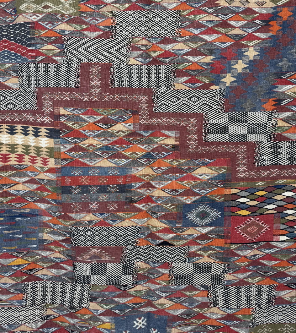 Close-up of Woven Ledger Taznakht rug showing Zanafi flatweave and raised hand-knotted wool texture